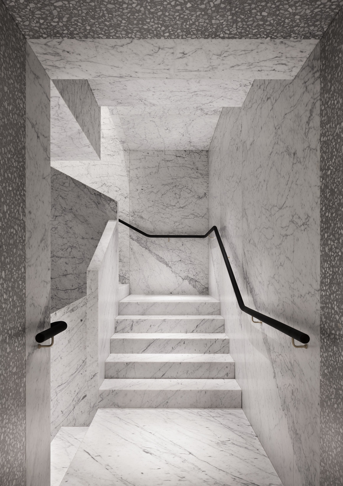 Valentino Flagship Store in Rome develops between Piazza di Spagna and Piazza Mignanelli. All floors are connected by two staircases in marble.